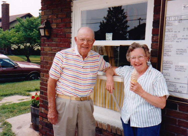 Bill and Lena Fay Koveners standing in front of the store